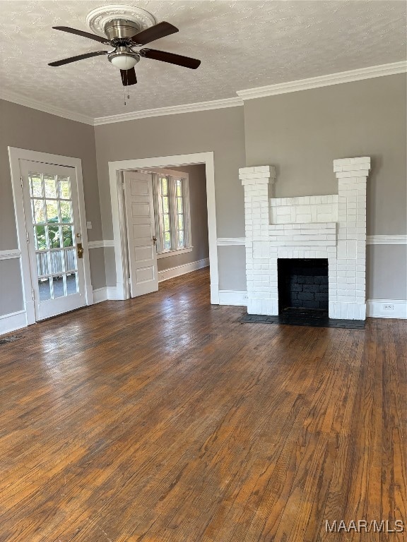 unfurnished living room featuring ceiling fan, a textured ceiling, ornamental molding, and dark hardwood / wood-style floors