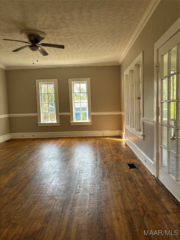 unfurnished room featuring ornamental molding, dark hardwood / wood-style floors, and ceiling fan