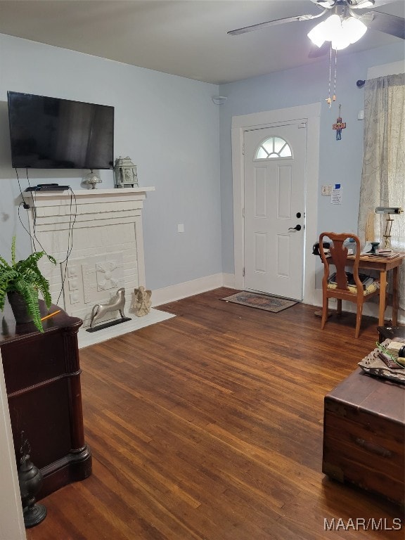 foyer entrance with wood-type flooring and ceiling fan