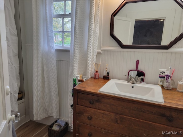 bathroom with hardwood / wood-style flooring and vanity