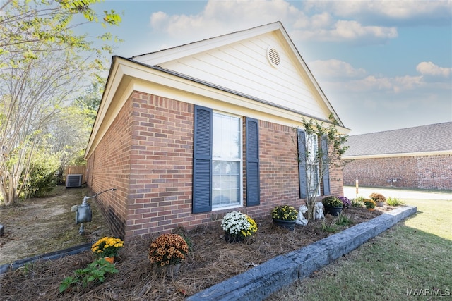 view of side of property featuring central AC unit