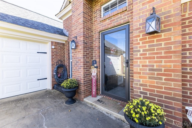 doorway to property featuring a garage