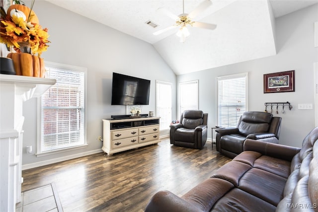 living room with a textured ceiling, ceiling fan, dark hardwood / wood-style floors, and vaulted ceiling