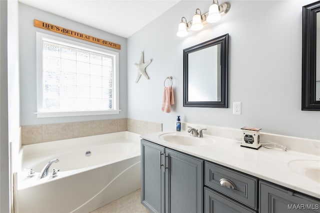 bathroom with tile patterned flooring, vanity, and a tub to relax in