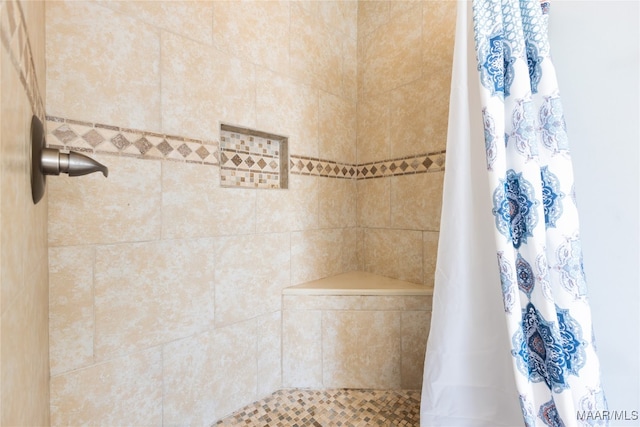 bathroom featuring a shower with curtain