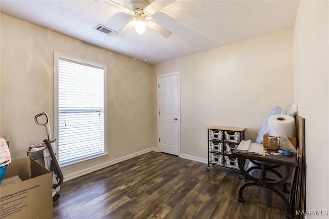 office space featuring dark wood-type flooring and ceiling fan