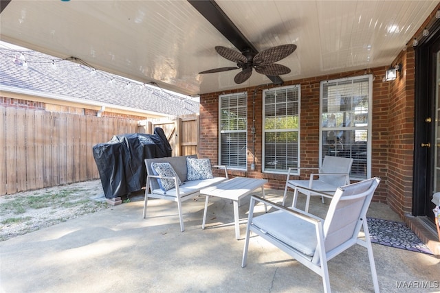 view of patio with ceiling fan and a grill