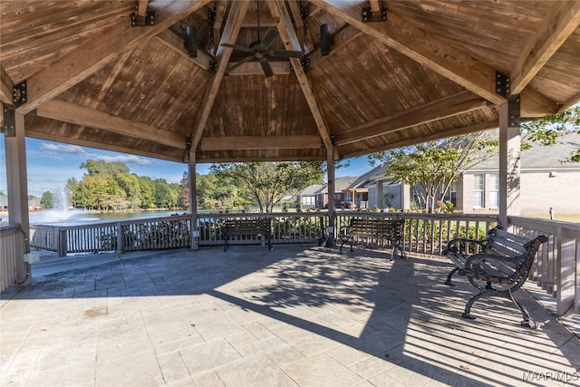 view of patio with a water view and a gazebo