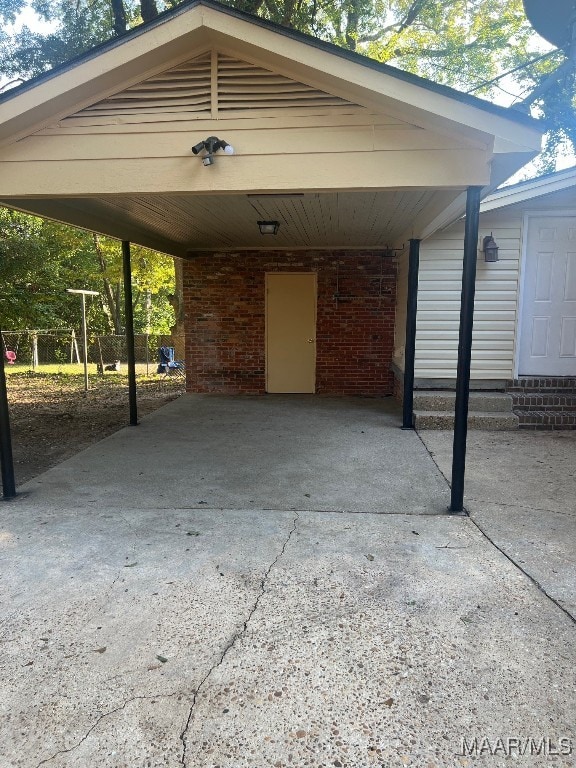 view of parking / parking lot with a carport