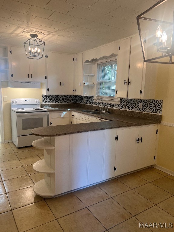 kitchen featuring white cabinetry, hanging light fixtures, sink, and white electric range oven