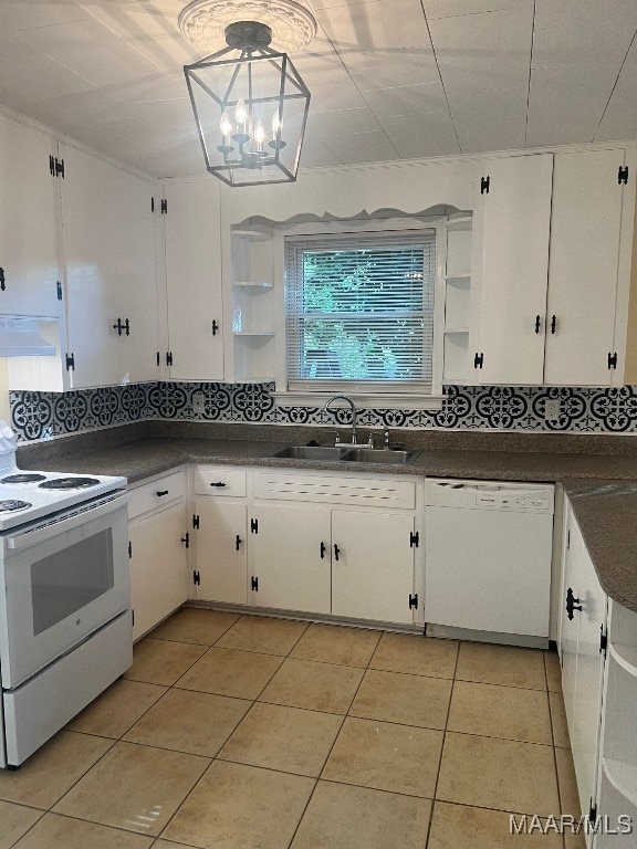 kitchen with white cabinets, white appliances, sink, and decorative backsplash