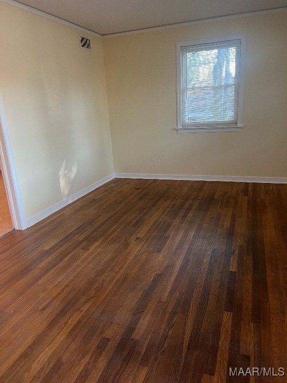 empty room with dark wood-type flooring