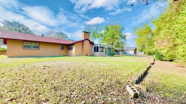 view of yard with a sunroom