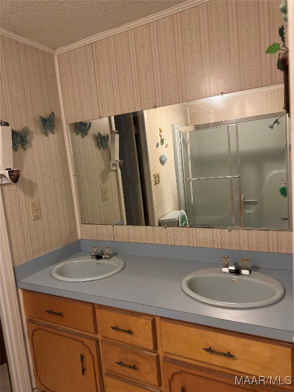 bathroom with vanity and a textured ceiling