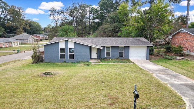 view of front of house with a garage and a front yard