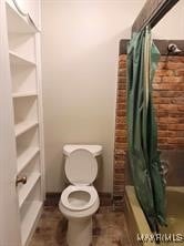 bathroom featuring toilet