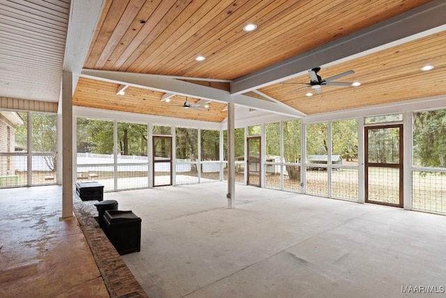 unfurnished sunroom featuring ceiling fan, vaulted ceiling with beams, and wooden ceiling