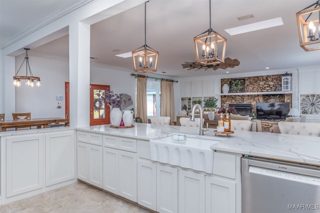 kitchen with light stone countertops, hanging light fixtures, crown molding, white cabinets, and dishwasher