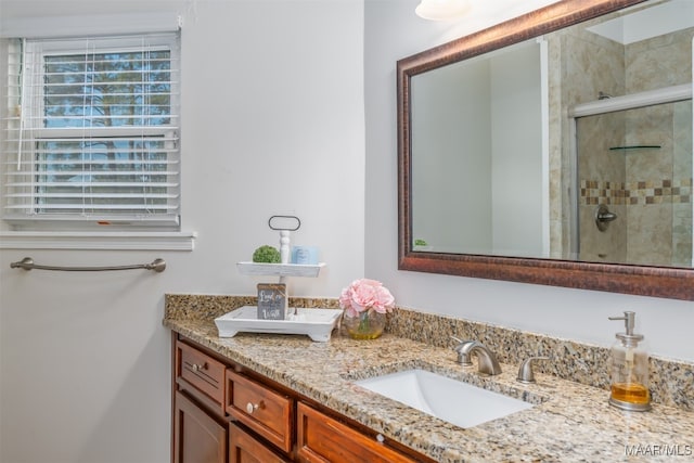 bathroom with vanity and an enclosed shower