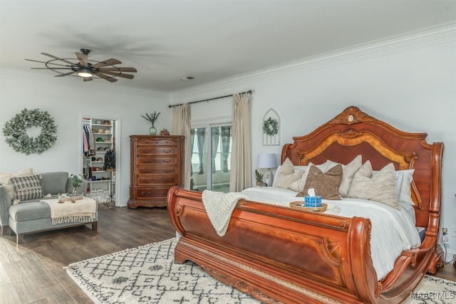 bedroom featuring hardwood / wood-style floors, ceiling fan, and ornamental molding