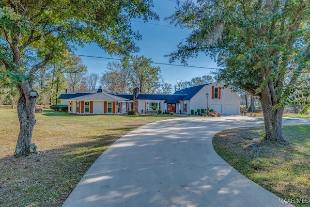 single story home with a garage and a front lawn