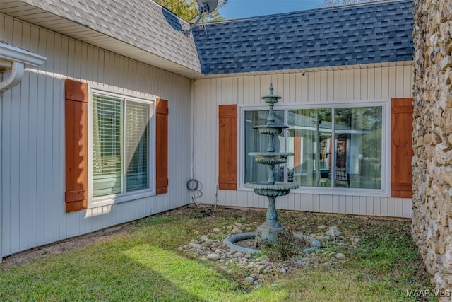 view of home's exterior with a yard