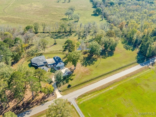 birds eye view of property featuring a rural view