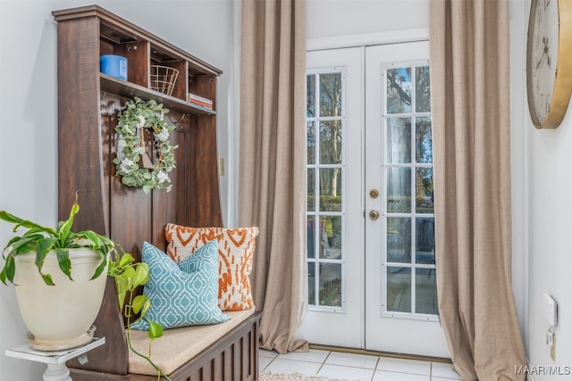 interior space with french doors and light tile patterned floors