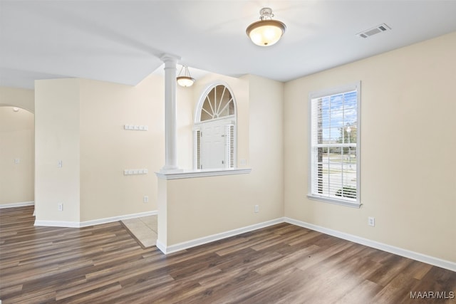 empty room featuring dark hardwood / wood-style flooring