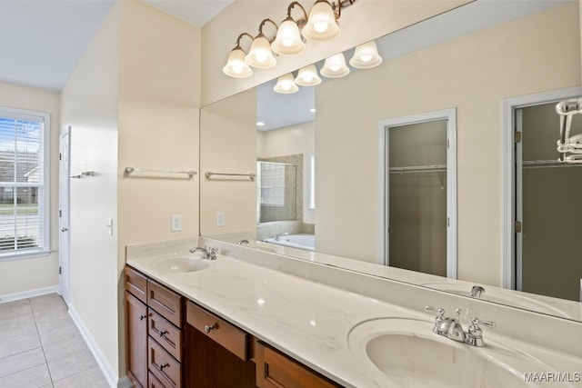 bathroom with independent shower and bath, vanity, and tile patterned flooring