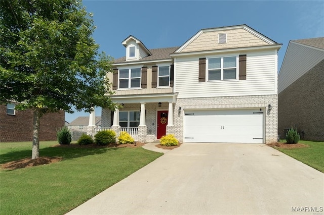 view of front of property with a garage, a front lawn, and a porch