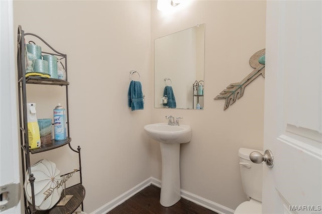 bathroom featuring toilet and hardwood / wood-style floors