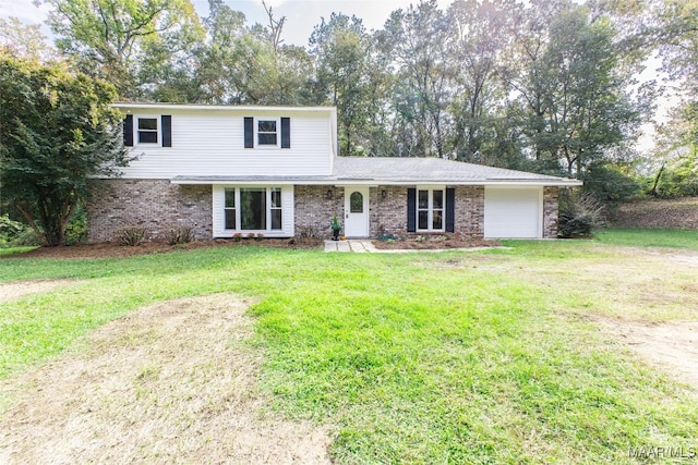 view of front property featuring a front lawn and a garage