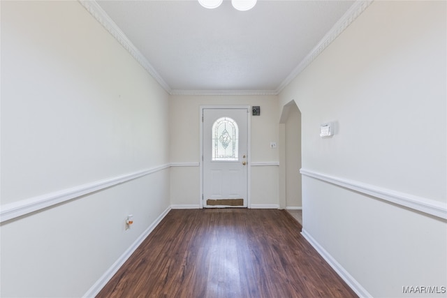 entrance foyer featuring dark wood-type flooring and crown molding