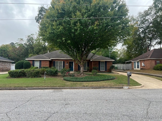 ranch-style house with a front lawn