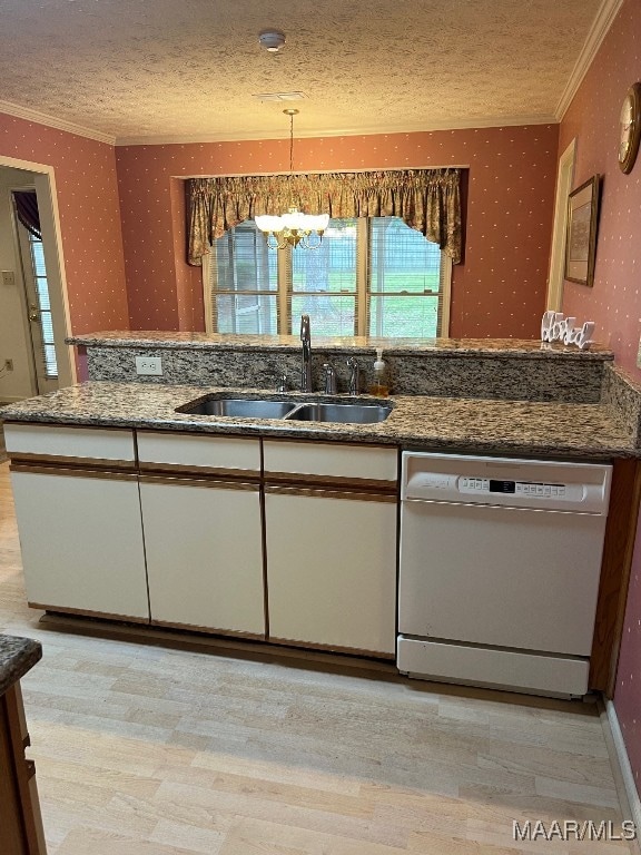 kitchen with dishwasher, a textured ceiling, sink, light wood-type flooring, and decorative light fixtures