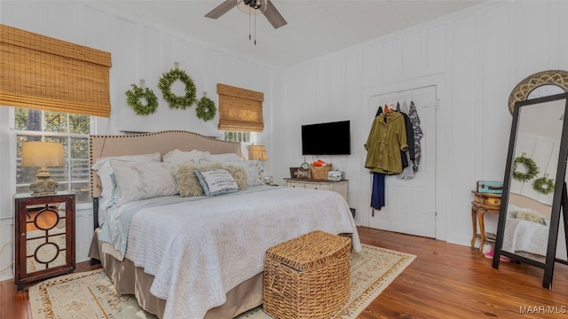 bedroom featuring wood-type flooring and ceiling fan