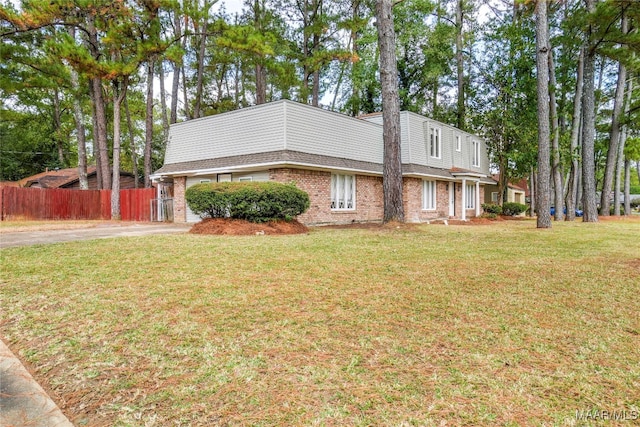 view of side of home featuring a lawn