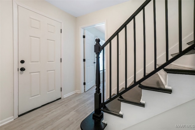 entrance foyer with light hardwood / wood-style flooring