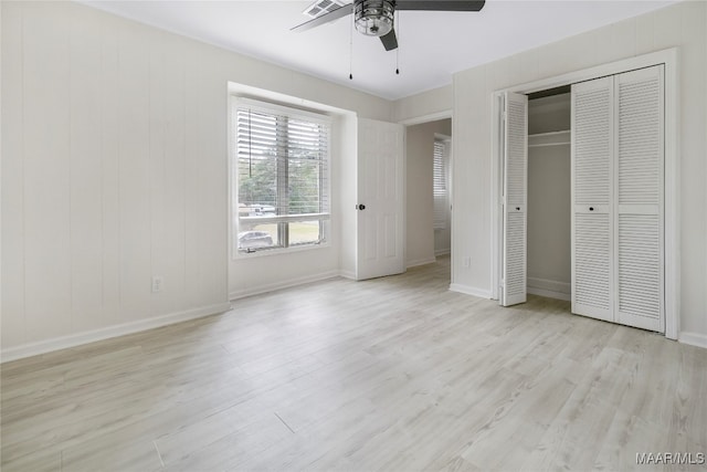 unfurnished bedroom with ceiling fan and light hardwood / wood-style flooring