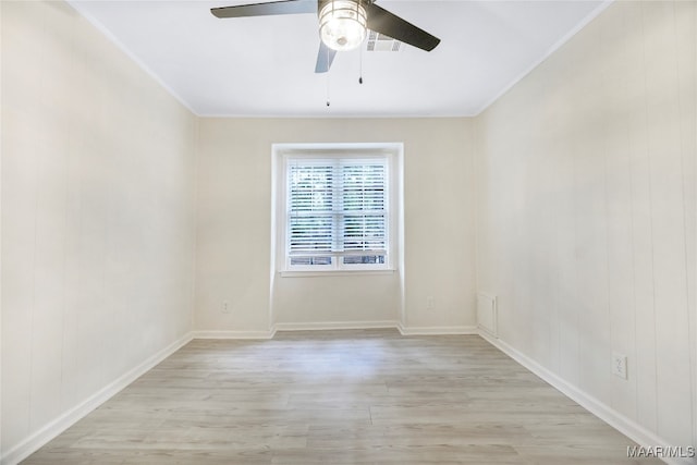 empty room with crown molding, ceiling fan, and light hardwood / wood-style flooring