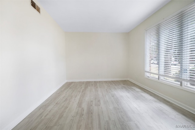 empty room with light wood-type flooring