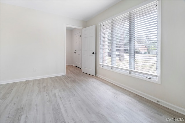 unfurnished room featuring light wood-type flooring