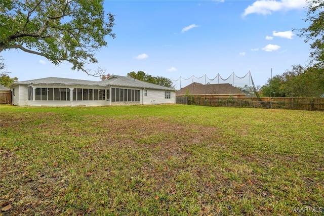 view of yard with a sunroom