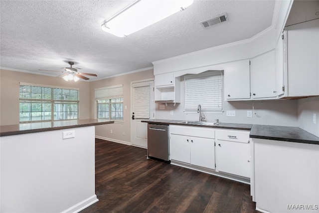 kitchen with a healthy amount of sunlight, stainless steel dishwasher, sink, and dark hardwood / wood-style floors