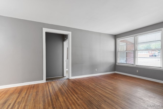 unfurnished room featuring wood-type flooring