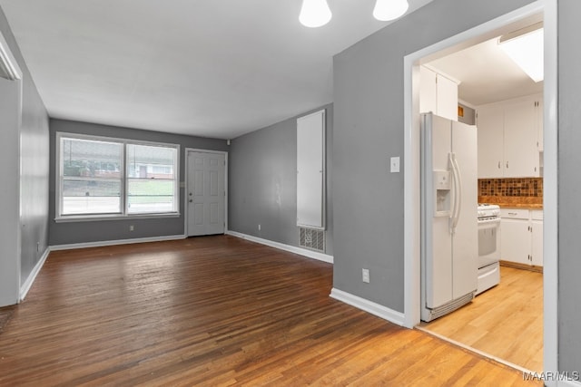 spare room with hardwood / wood-style floors