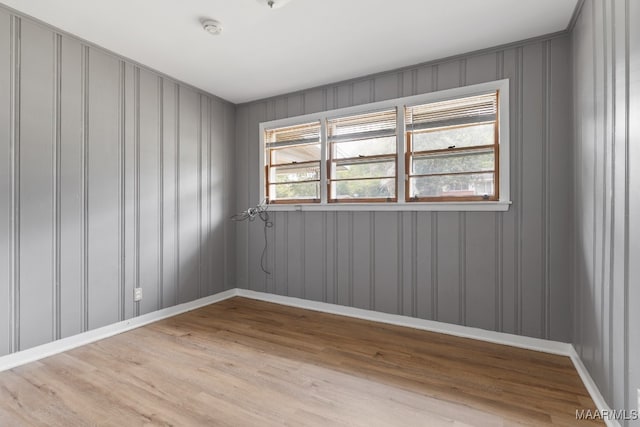 spare room featuring light hardwood / wood-style floors