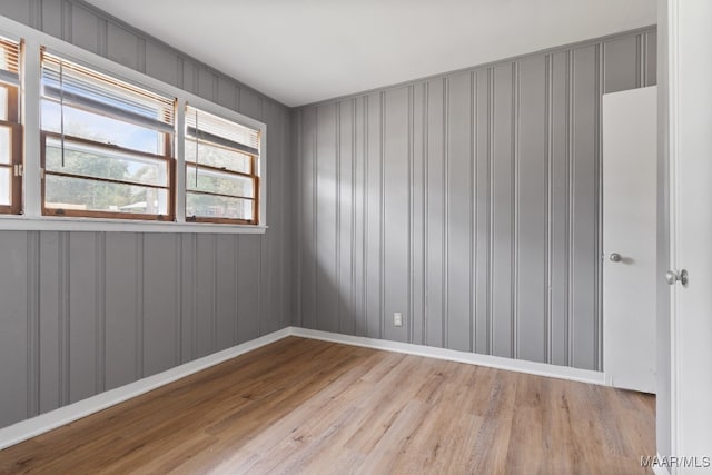 spare room with light hardwood / wood-style flooring