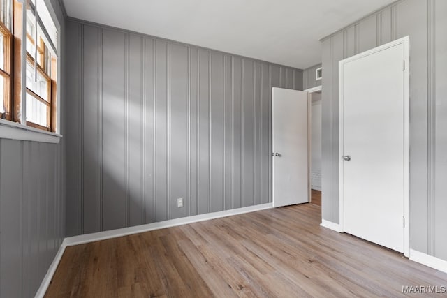 empty room with light wood-type flooring